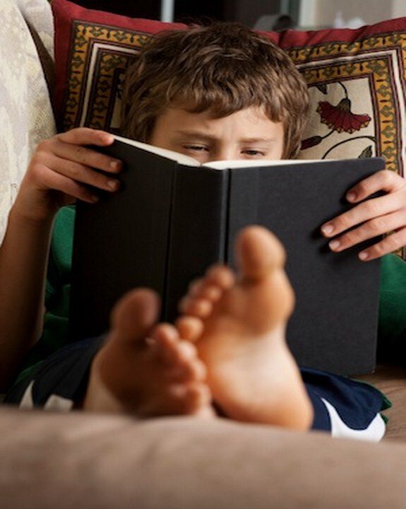 boy-reading-book-couch-copy.jpg